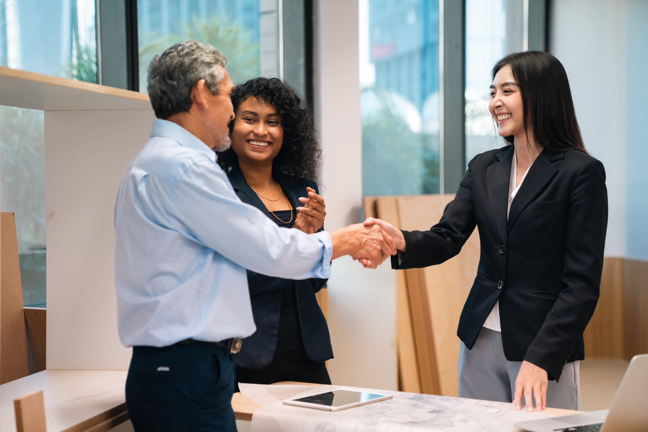 A salesperson shaking hands with a client