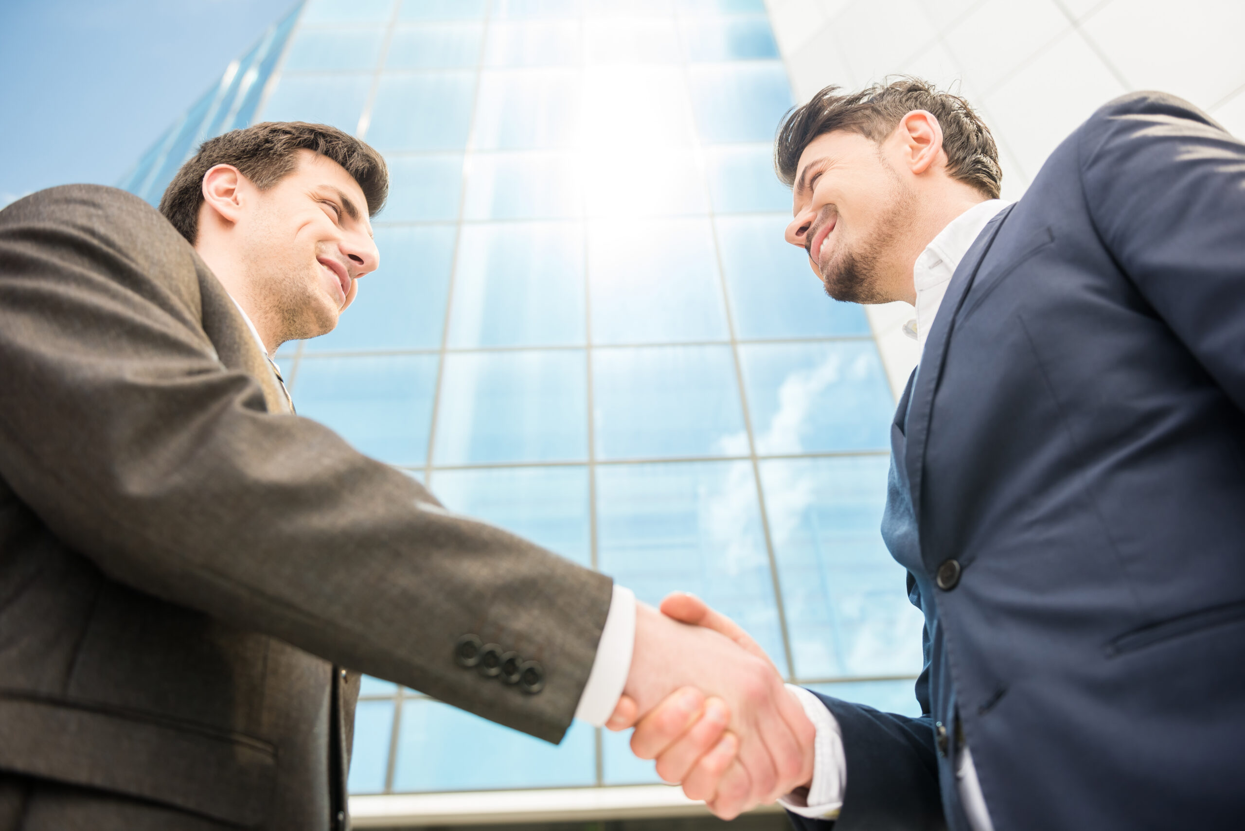 A businessman closing a deal while developing as a professional
