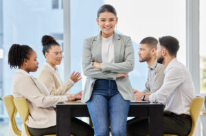 A summer marketing intern crossing their arms